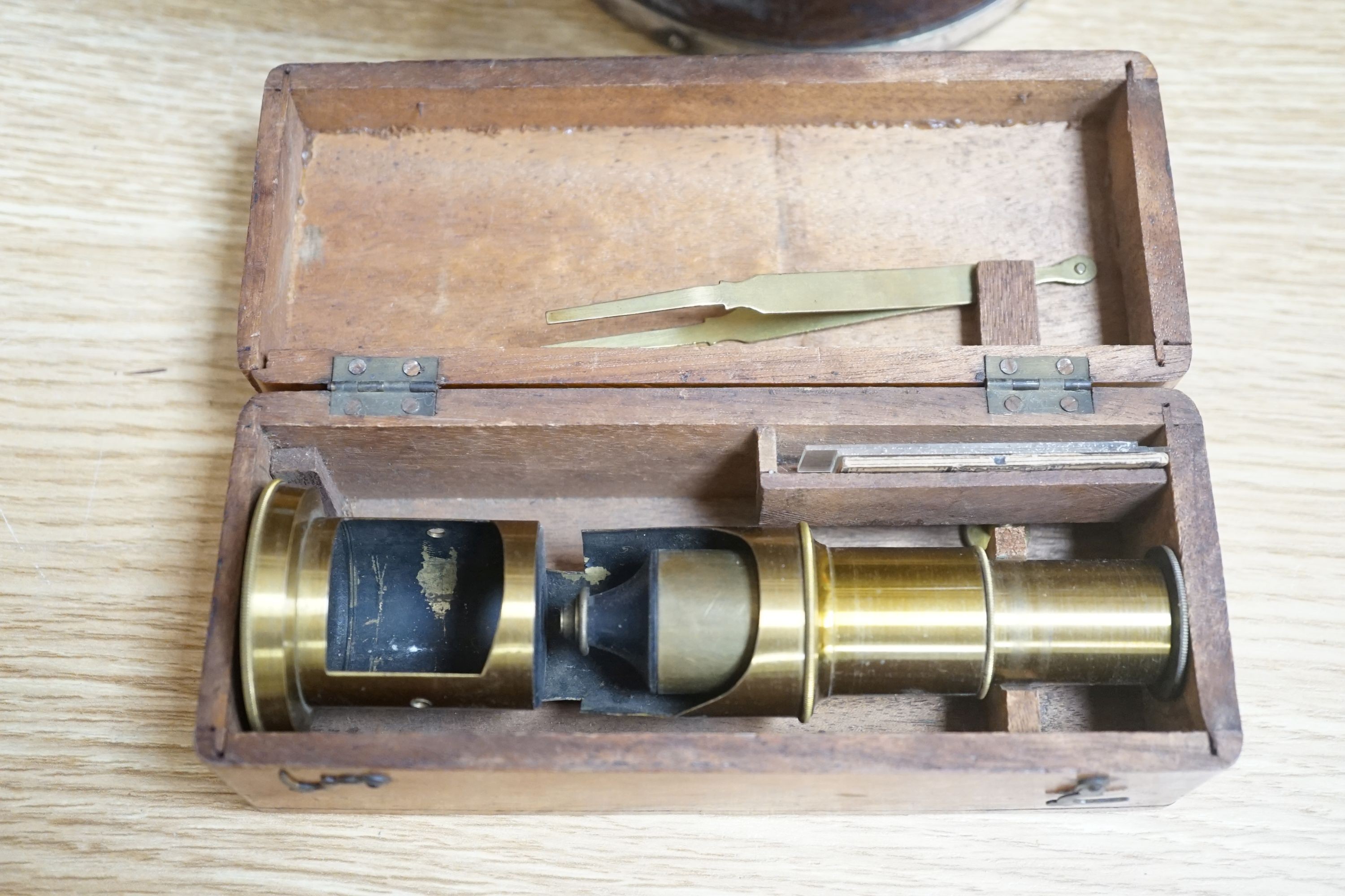 A Victorian sarcophagus tea caddy, stationary box, compound microscope and others